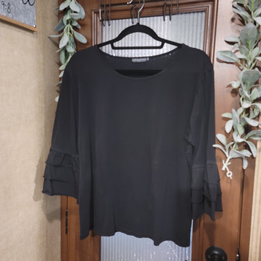 Black shirt with ruffle sleeves